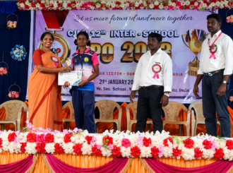 JMJ School student receiving an achievement award